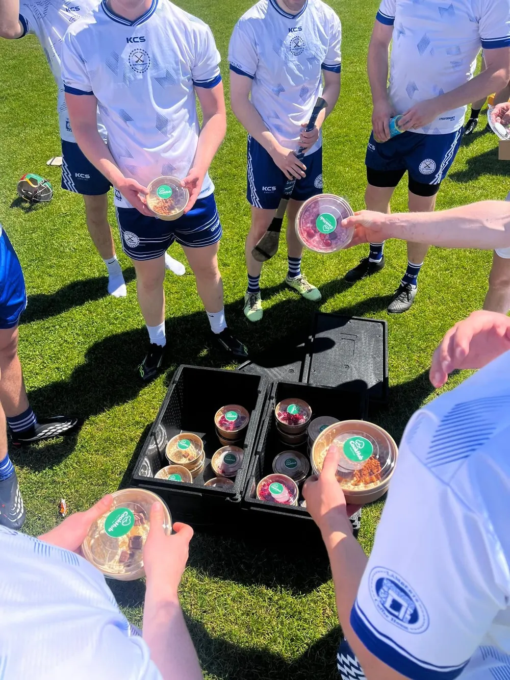 A club team grabbing oats after training